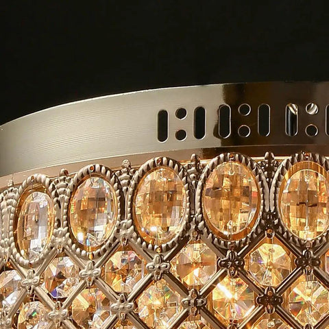 Close-up of Gold Crystal Chandelier Flush Mount Ceiling Light With Diamond Drum Shade luxury design detail and crystal accents.
