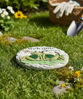 Frog Garden Stepping Stone With Welcome Friends Message, 1.2 Inch Low Profile Concrete Plaque in garden setting, green and grey.