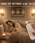 Cozy living room scene with No Fuss Wall Sconces Set Of Two In Shiny Gold and remote for RGB lighting, woman asleep with cat.