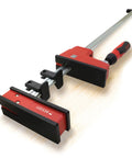 Heavy Duty 40 Inch Parallel Clamp Delivering 1700 Lbs Of Tight Grip For Woodworking Cabinetry And Weekend Project Grind with red handle.