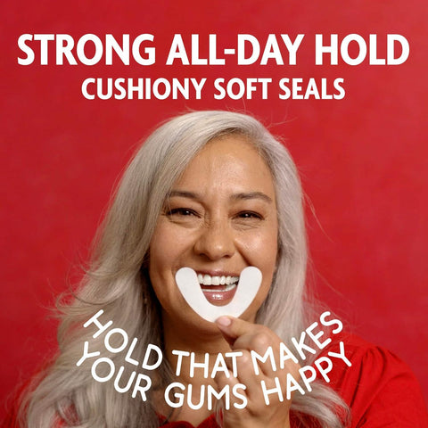 Person holding Original Flavor Denture Adhesive Seal For Lower Dentures, Zinc Free, All Day Hold, Mess Free, 30 Count Pack.