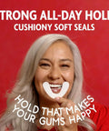 Woman smiling holding Secure Denture Adhesive Seals For Upper Dentures Zinc Free All Day Hold No Mess Comfort Cushioned Release Technology