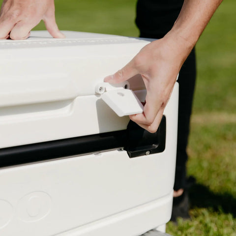 MaxCold Glide 110 Qt Insulated Rolling Cooler latch detail with hands showing lockable leak-proof design feature