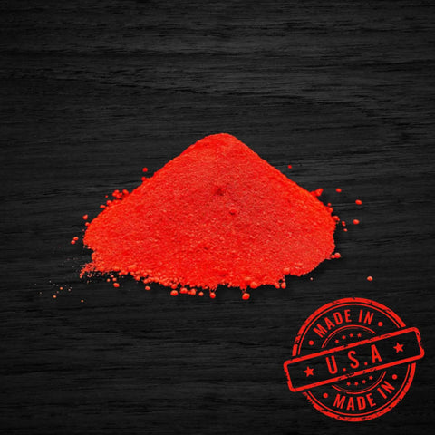 Three Pound Baboon Butt Red Extreme Visibility Marking Chalk with pile of red powder and Made in USA stamp on dark background