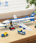 510 Piece City Passenger Airplane Building Set with plane, shuttle, and trucks on a desk for display or play.