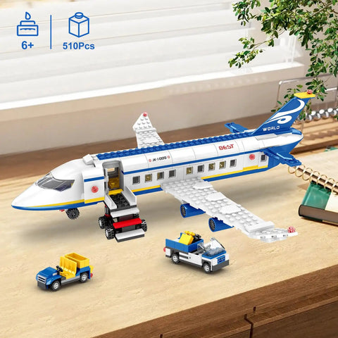 510 Piece City Passenger Airplane Building Set with plane, shuttle, and trucks on a desk for display or play.