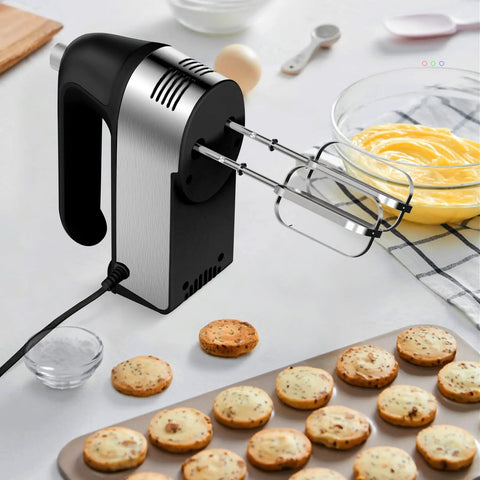 No Sweat Electric Hand Mixer With Gutsy 450W Motor and Handy Scale Cup Storage Case featuring mixing dough and cookies.