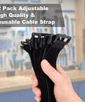 Heavy Duty 1.5 x 24 Inch Hook And Loop Cable Ties 12 Pack Adjustable Fastening Straps With Plastic D Ring Buckle shown in hand