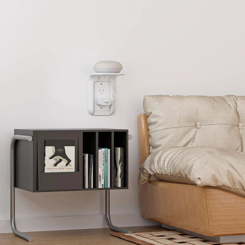 White Outlet Shelf Wall Organizer in living room with smart device, mounted above books on black shelf; outlet shelf holds up to 10lbs.