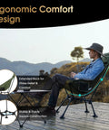 Person relaxing outdoors in High Back Folding Camping Chair With Three-Position Height Adjustment, scenic mountain view.