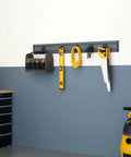 Wall Mounted Storage Track System For Garage And Workshop Includes Two 28 Inch PVC Panels And Five Hooks Heavy Duty Support Up To 150 Lbs Per Panel Flexible Modular Organization installed with tools and accessories.