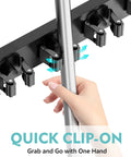 Close-up of No Drill Over The Door Mop And Broom Holder With Four Slots And Four Hooks Wood Tool Hanger in use with hand.