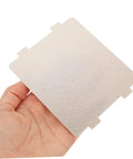 Hand holding a Must Have Ten Piece Microwave Waveguide Cover Mica Insulation Sheet for heat resistance and microwave oven protection.
