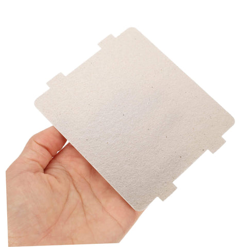 Hand holding a Must Have Ten Piece Microwave Waveguide Cover Mica Insulation Sheet for heat resistance and microwave oven protection.