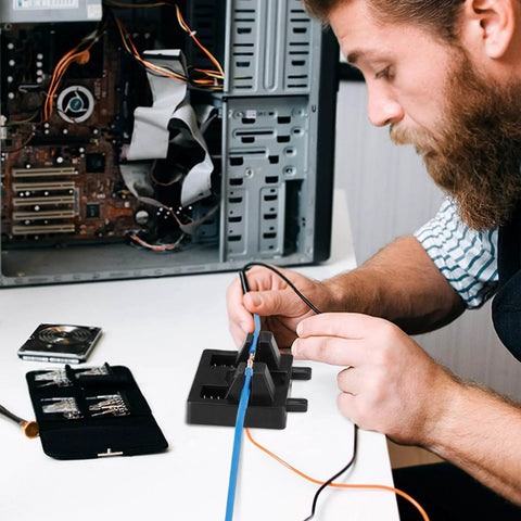 Man using Six Piece Wire Welding Fixture Set For Soldering, Hands Free Wire Holder For MIG TIG And Spot Welding on electronics