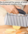 JAYVAR large crinkle cutter, side view; black handle and stainless steel wavy blade for potatoes.