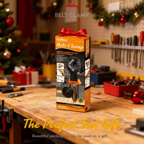 Box of Band Clamp For Woodworking And Picture Framing on a workbench, surrounded by tools and holiday decorations.
