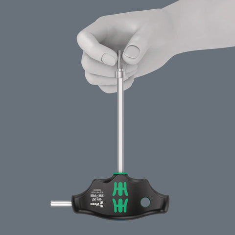 Hand using 4547 HF T-Handle Screwdriver Set With Hex-Plus, Holding Function, ergonomic grip, demonstrating high torque comfort