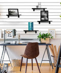 8 Pack Wood Slatwall Shelves With Heavy Duty Metal Brackets For Garage And Home Organization Built Tough As Nails For Everyday Use 23.6 By 11.8 Inches Slatwall Shelf System Durable Wall Mounted Storage Racks installed above a desk with decorative items