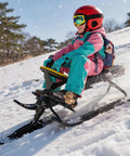 Child riding Steering Wheel Snow Racer Sled With Brakes, Kart Style Design For Kids And Adults, on snowy hill
