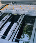 M8 Eye Bolt 4 Pack For Roof Rack And T Slot Systems Black Heavy Duty Tie Down Rings installed on a roof rack with gear