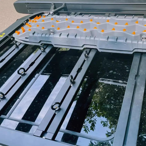 M8 Eye Bolt 4 Pack For Roof Rack And T Slot Systems Black Heavy Duty Tie Down Rings installed on a roof rack with gear