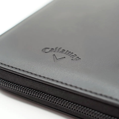 Close-up of black Glove Caddie Wallet for Golfers with zipper, showing premium leather texture and Callaway logo.
