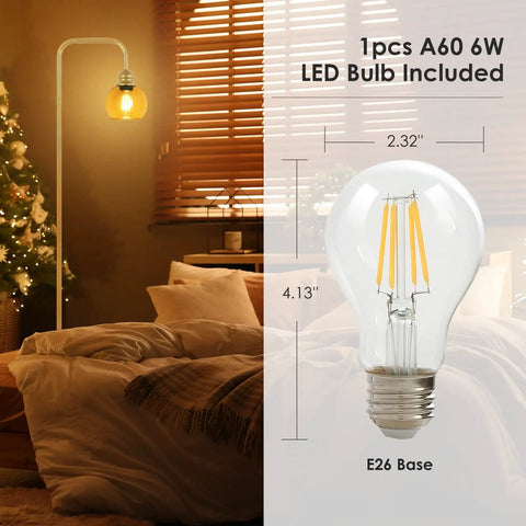 Modern Floor Lamp With Amber Glass Globe Shade And 6W LED Bulb in living room with cozy setup, showing bulb dimensions.
