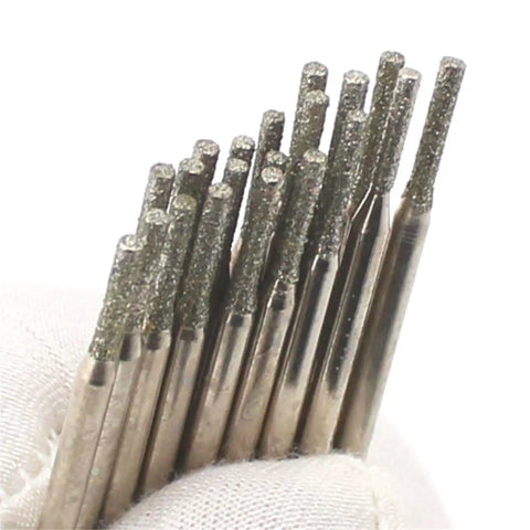 Close-up of 1.5mm Diamond Drill Bits For Stone And Sea Glass Jewelry Making Pack Of 30 Pcs Lapidary Gemstone Drill Bits in a gloved hand.