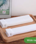 60 Pack Hook And Loop Cable Ties 6 7 8 Inch White on wooden tray with tablet in background