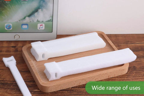 60 Pack Hook And Loop Cable Ties 6 7 8 Inch White on wooden tray with tablet in background