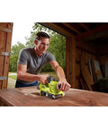 Man using Cordless 18V Brushless Belt Sander, 3 X 18 Inches, One Plus Compatible, Includes Dust Bag and Sanding Pad
