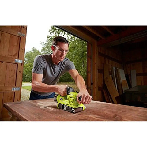 Man using Cordless 18V Brushless Belt Sander, 3 X 18 Inches, One Plus Compatible, Includes Dust Bag and Sanding Pad