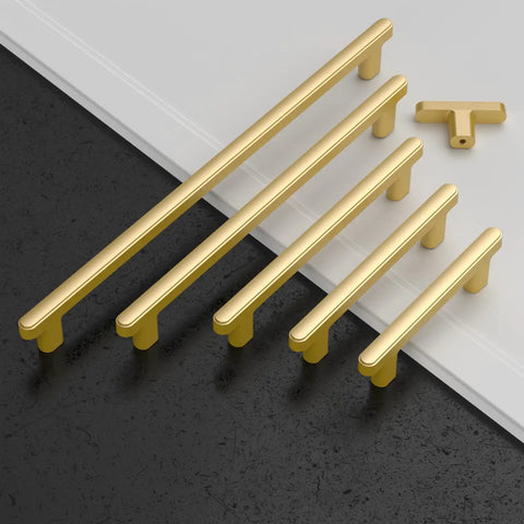 Top Shelf 10 Pack Brushed Gold Cabinet Pulls 5 Inch 128 mm Spacing kitchen drawer handles, showcasing varying lengths on a countertop.