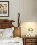 White Pleated Ceramic Shade Brass Vintage Pendant Light With Adjustable 59 Inch Chain by bedside in cozy bedroom setting.