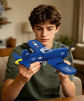 Teen assembling the WW2 Military Airplane Building Kit Featuring F4U Corsair Fighter Jet Model Set With 562 Pieces.
