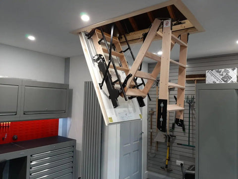 Top Shelf Electric Attic Pull Down Stairs With Wireless Remote Fits Ceilings 7Ft 8In To 9Ft 6In Beech Hardwood Tread seen from inside attic