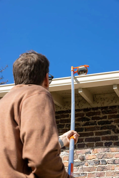 Person using Expandable Inspection Mirror On A Pole For Roofs Gutters Ductwork Under Vehicle And Car Inspections Retractable Security Mirror