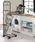 Three-Tier Laundry Cart On Wheels With Heavy-Duty Wire Baskets in a laundry room, showcasing removable bins and garment rack for storage.