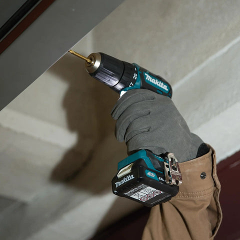 Badass 12v Max Lithium Ion Cxt Brushless Drill Driver Featuring Electric Brake And Bright Led Lamp Keyless Chuck Compact Heavy Duty Cordless Tool Built Different For Real World Projects in action with user.