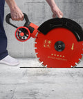 Heavy Duty Electric Concrete Saw With Four Thousand Watt Motor And Industrial Diamond Blade cutting through concrete.