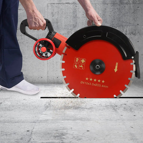Heavy Duty Electric Concrete Saw With Four Thousand Watt Motor And Industrial Diamond Blade cutting through concrete.