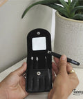 Hand holding Stainless Steel Precision Tweezer Set With Mirror Case Four Piece Kit; classic, slanted tips shown.