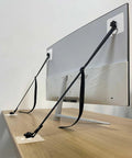 Two Pack Adjustable TV Safety Straps No Drill Adhesive Anti Tip Furniture Anchors Installed on Flat Screen and Desk