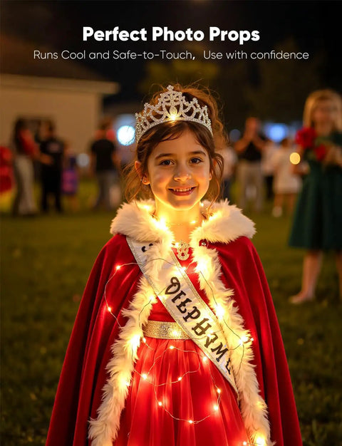 Child wearing a crown and sash wrapped in 14 Pack Battery Operated LED Fairy Lights On 7ft Silver Wire Waterproof Twinkle String Lights