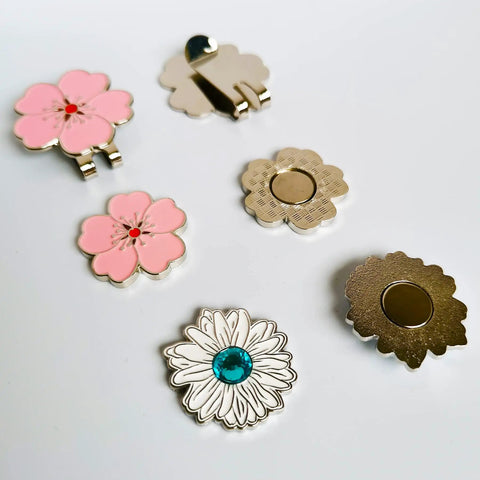 Magnetic Golf Ball Marker Set With Flower Crystal Markers And Hat Clip 10mm Reinforced Magnetic Ball Marker displayed on white