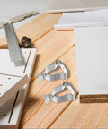 Heavy Duty Window Well Cover Retaining Clips 10 Pack Spring Clamps For Secure Basement Install Quick Easy Hold Down Kit Hardware, silver steel clips on wood panel