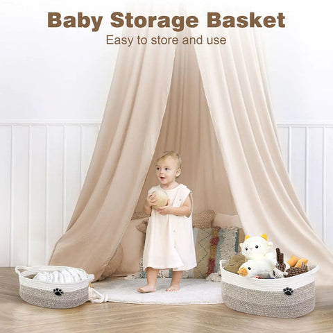 Child standing in front of two storage baskets with toys, under a beige canopy; image for Large Dog Toy Storage Basket Rope Bin 30L For Toys And Blankets Pet Gear White And Brown 19.7 X 11 X 7.9 Inches Durable Woven Rope Organizer For Living Room Or Bedroom.