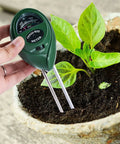 Person using Three In One Soil Tester With Moisture, Light And PH Meter For Gardening And Lawn Care, No Batteries Required.