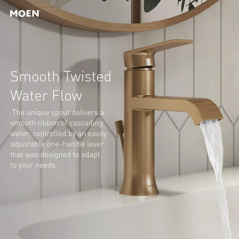 Brushed gold bathroom faucet with high arc spout and single handle on white sink, water cascading smoothly.